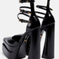 Black Faux Leather Double Platform Pointy Pumps With Triple Ankle Straps Detailing