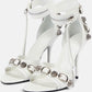 Studs And Buckles Embellished Metallic Crinkled Ankle Heeled Sandals - White